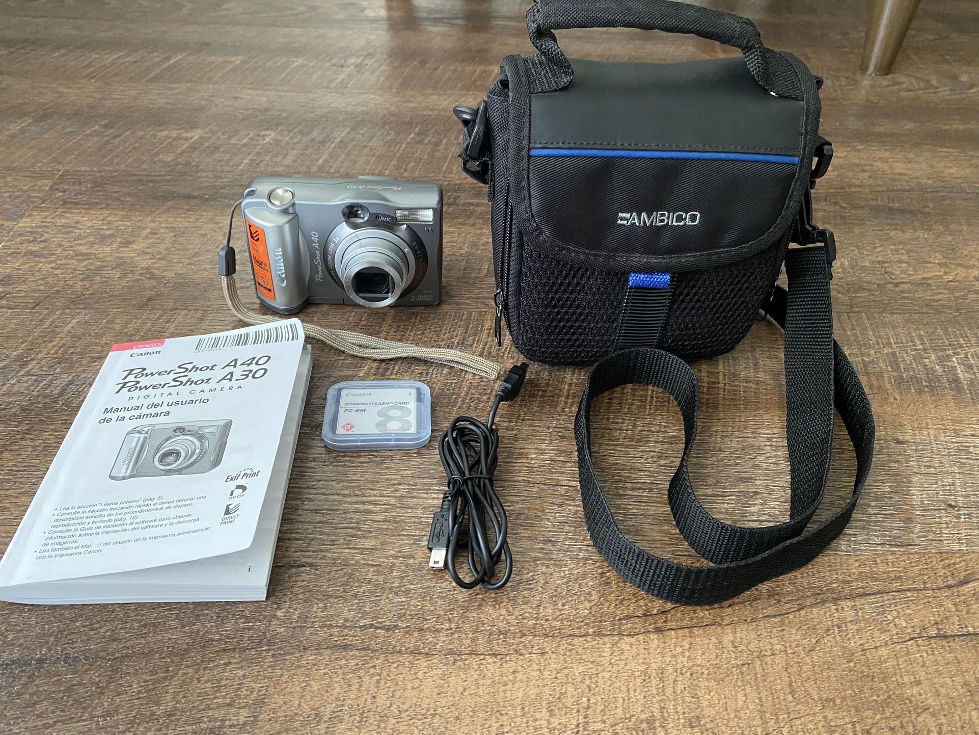 Pre-owned Canon Powershot UA/40 Digital Camera 2.0MP 3x Optical zoom with a memory card, original manual, storage case and USB cord.