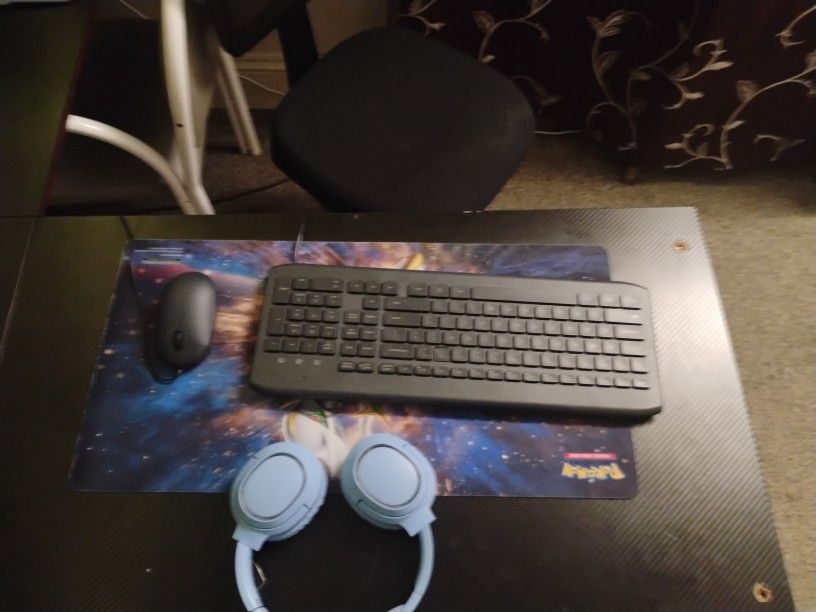 Keyboard Headphones And A Mouse Plus A Mouse Pad