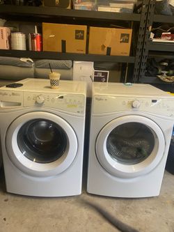 Whirlpool Duet front-load washer and dryer set with normal cosmetic wear.