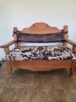 Rustic Pine Bench with Faux Cowhide Cushions