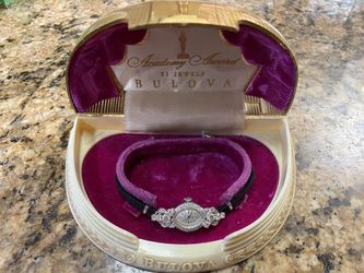 Bulova Ladys Daimond Watch With Black Cord Band.