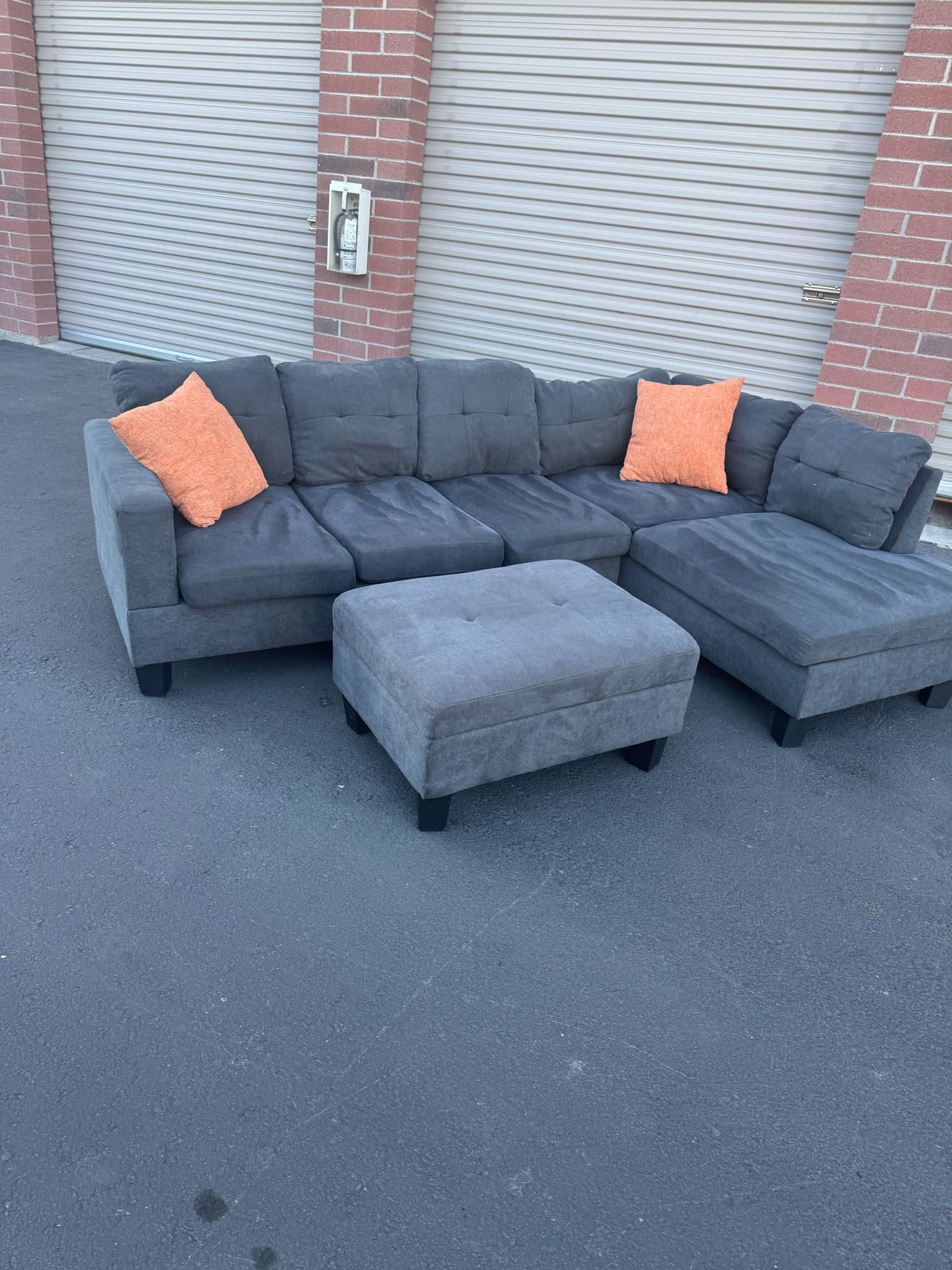 awsome gray sectional with storage ottoman