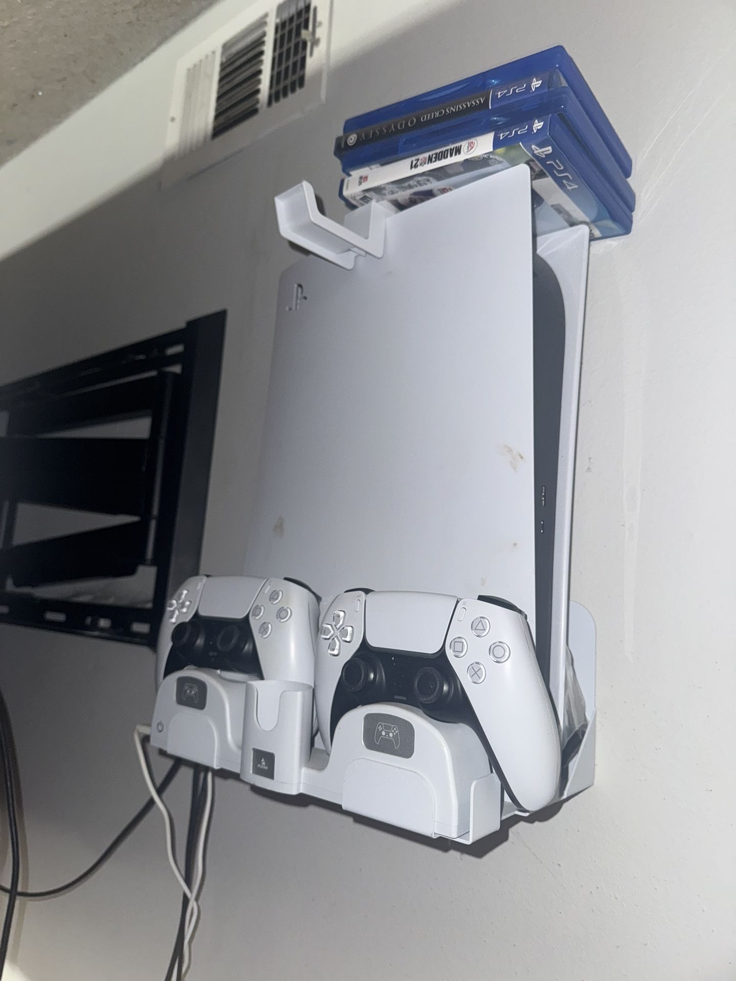 PS5 With Two Controllers And Wall Mount