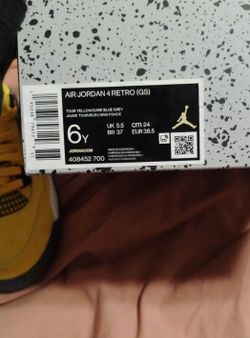6y  Nike Air Jordan 4 Retro GS "Thunder" in Tour Yellow and Dark Blue Grey.