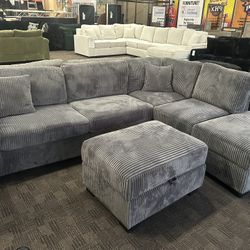 Charcoal Gray Reversible Chaise Sectional And Storage Ottoman 
