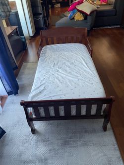 Toddler bed. Dark wood. Gently used.