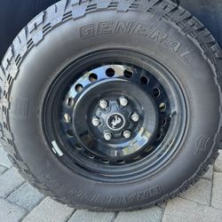 Ford Bronco Black Diamond Steelies with General Grabber tires.