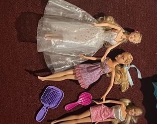 Used Barbie dolls with mini hair brushes