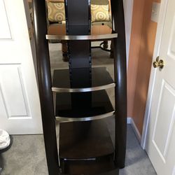 All Black And Silver Tv Stand With A Few Drawers