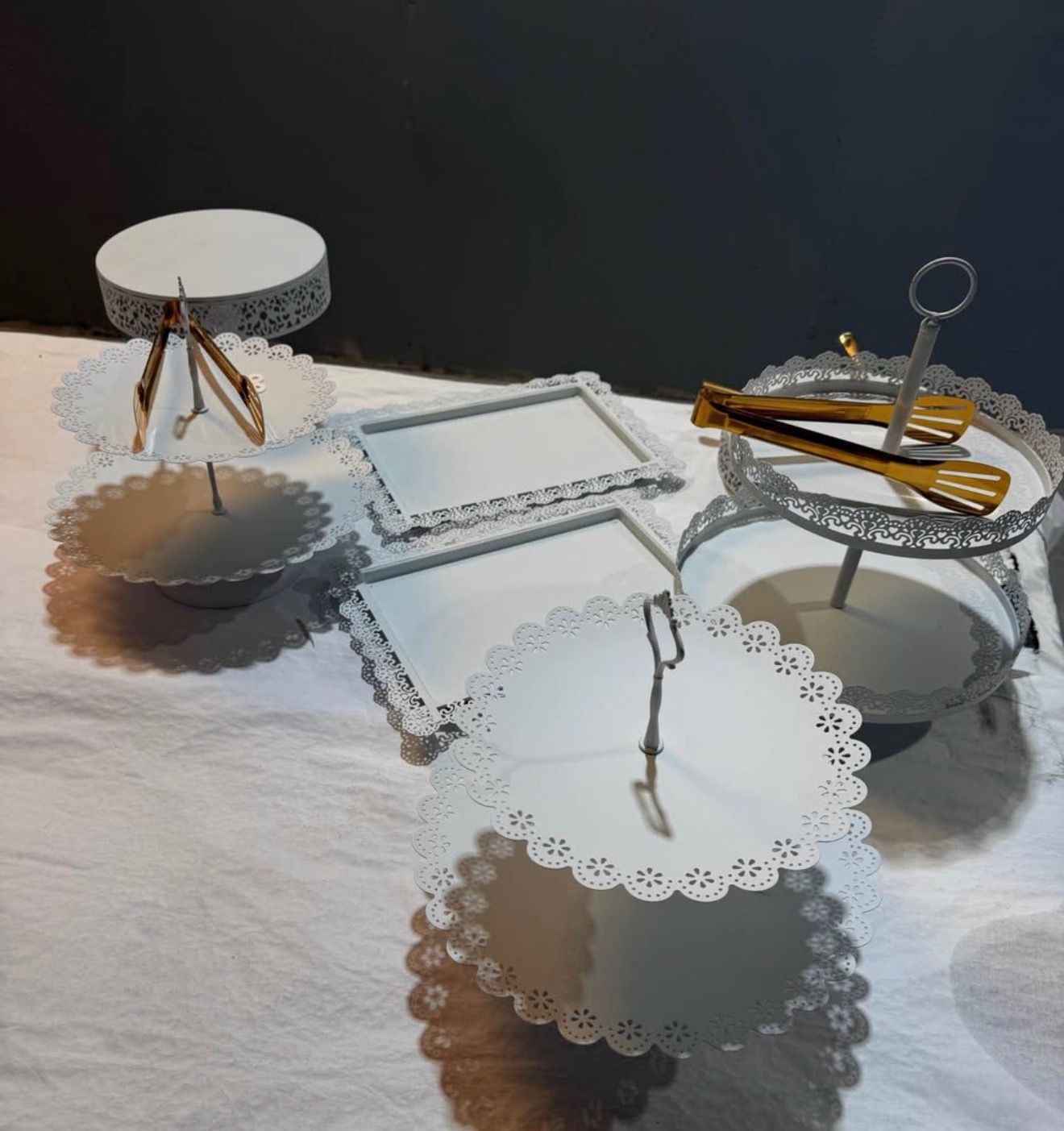 11-piece elegant white metal cake stand and dessert display set.