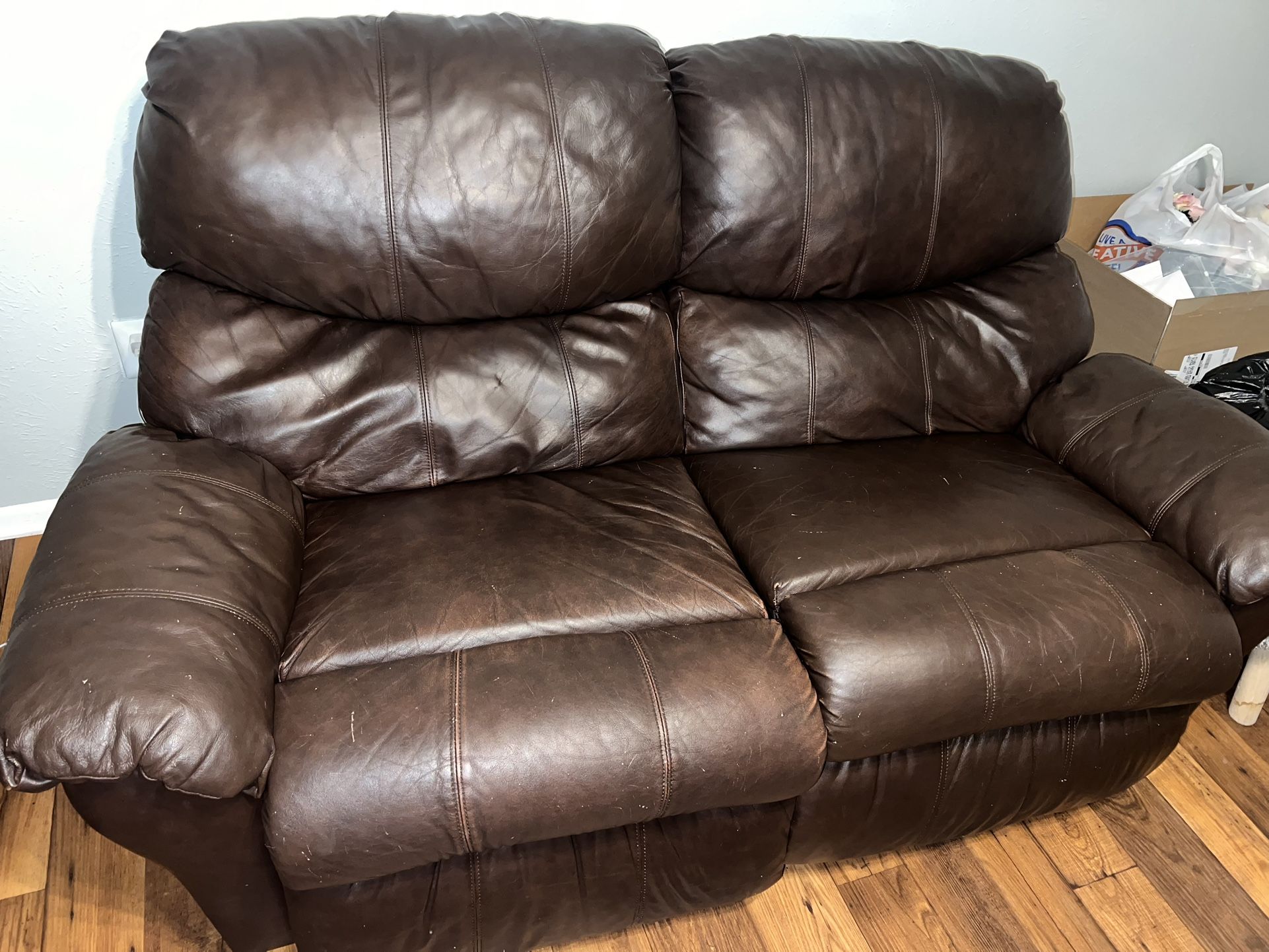 Brown Leather Reclining Couch And Ottoman