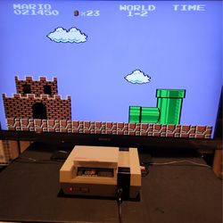 Original Nintendo Nes with Mario and Duck Hunt Game and Controller