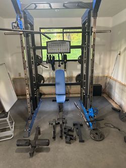 Home gym with Olympic bar + weights
