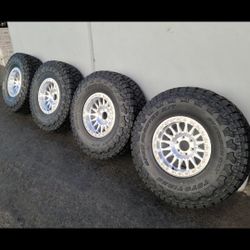 17" Kmc Impact w/ 37" Toyo Tires
