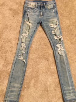 Blue ripped jeans with diamond studs