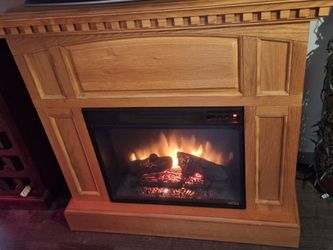 Electric Fireplace with Oak Wood Mantel. Get ready for winter. Great comfort.