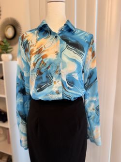 long-sleeved printed blouse.