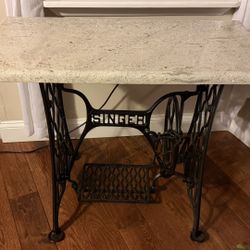 Vintage Singer sewing machine treadle base with a custom granite top