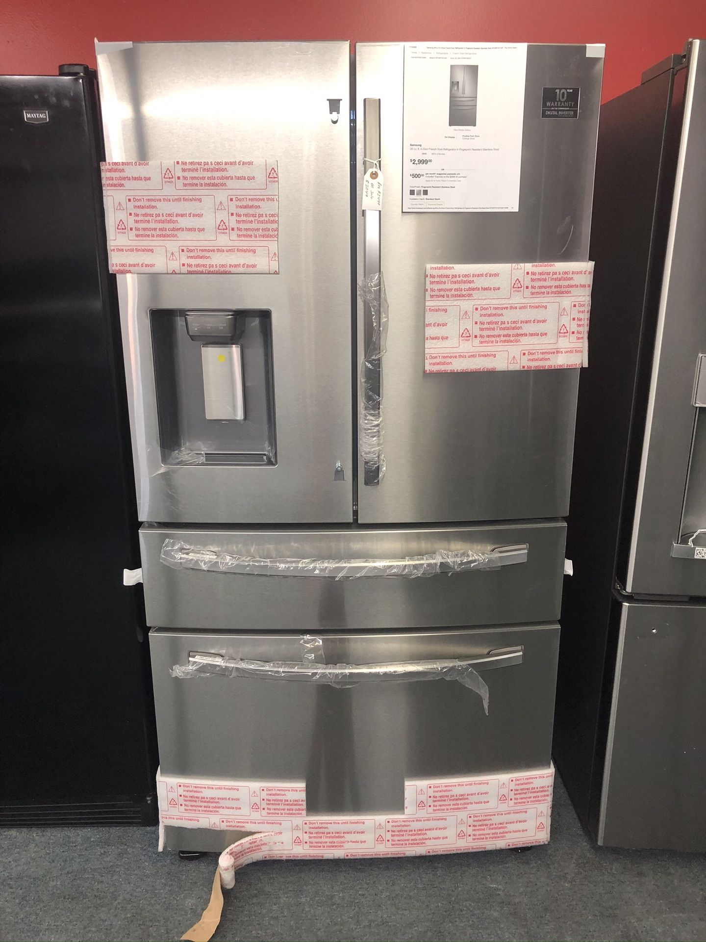 New scratch and dent Samsung 28 cu ft 4 door stainless steel fridge. 1 year warranty