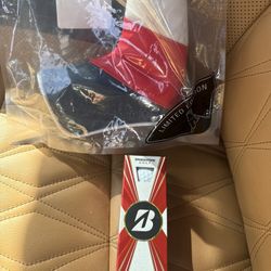 (2) Blade Putter Covers & Sleeve Of Bridgestone Balls 
