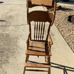 Wooden high chair with wicker seat