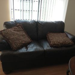 Brown leather sofa and love seat set