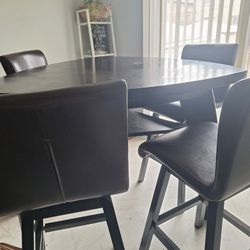 Tall Table Set W/4 stools & bench. Good condition, heavy.