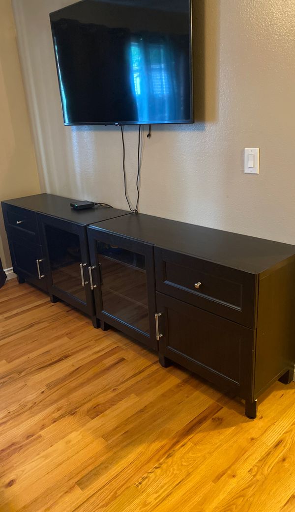 Black IKEA Entertainment Center . (Two large pushed together