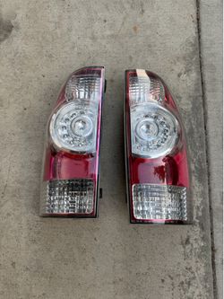 2015 toyota tacoma taillights OEM fits 2005 to 2015 asking $150 thanks