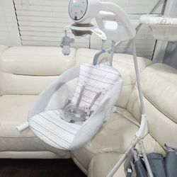 Ingenuity InLighten 5-Speed Baby Swing - Swivel Infant Seat, 5 Point Safety Harness, Nature Sounds, Lights - Van Elephant