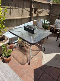 Patio table with fire place