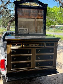 Black and gold dresser with mirror