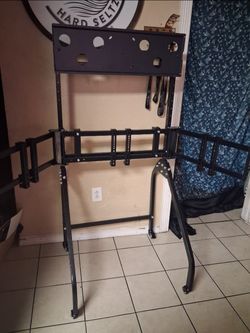 Gaming triple tv monitor stand roller with extra tv mount on it to hold up to a 55 in sim racing