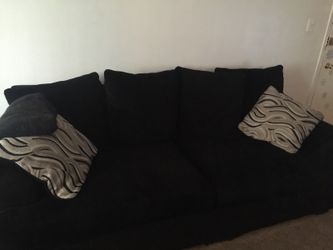 Black sofa in like new condition everything must go by this Tuesday