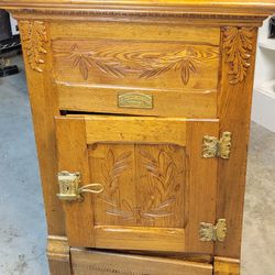 Antique icebox cabinet, manufactured by The Northern Light Company