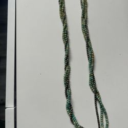 multi-strand beaded necklace with turquoise and bronze-colored beads