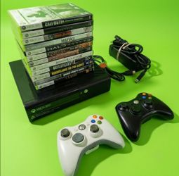 Microsoft Xbox 360 slim with 2 controllers 12 games HDMI cord power supply