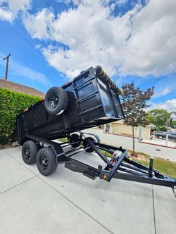 NEW DUMP TRAILER 12x8x4 12000 LBS
ROLLING TARP--SPARE TIRE,ELECTRIC BRAKES,HYDRAULIC SYSTEM,REMOTE CONTROL,IDEAL FOR HAULING, DEMOLITION, TRASH ETC,FO
