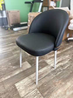Black accent chair with gold trim