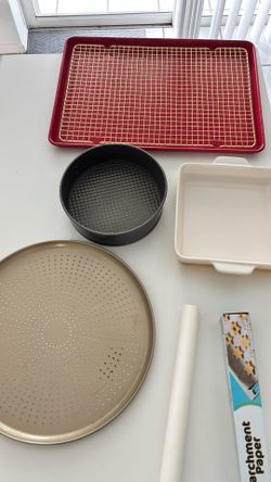 Bakeware. Cake and cheesecake pans, baking dishes, pizza heating and baking trays, general bakeware, and parchment paper.