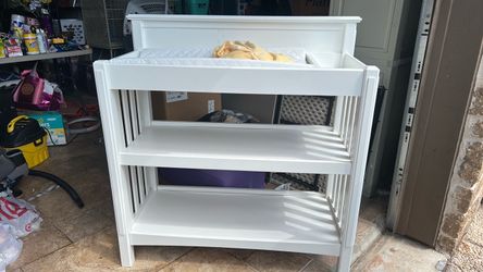 White diaper changer with storage shelves
