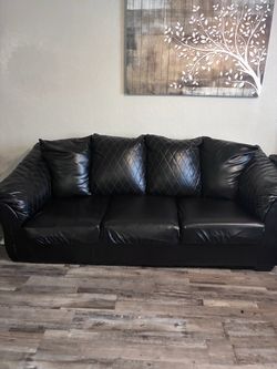 Black “leather” Sofa/Loveseat