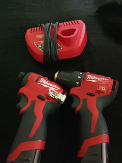 Milwaukee Drill & Driver Combo Set with Charger. Use 3 times nothing wrong with them