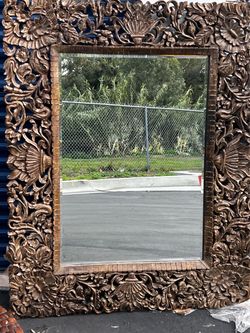 Beautiful carved hawaiian style mirror
