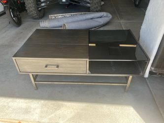Nice wood and part glass coffee table.