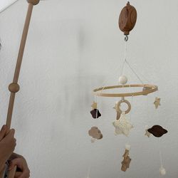 Baby crib arm, music box, and mobile