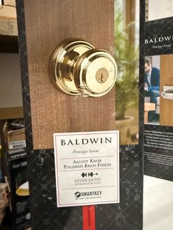 Baldwin Prestige Alcott Polished Brass Entry Door Knob Featuring SmartKey Security
