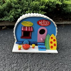 wooden birdhouse of a surf shop at the beach