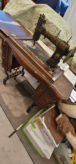 Antique White Rotary treadle sewing machine housed in wooden cabinet 32hx19dx34w 1913s Cleveland USA