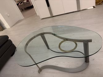 Coffee cocktail table thick glass kidney shaped top. Matte chrome & gold brass MCM Art Deco base.  About 48” Long X 36” Wide.